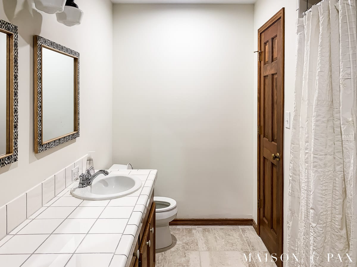 white bathroom with wood trim | Maison de Pax