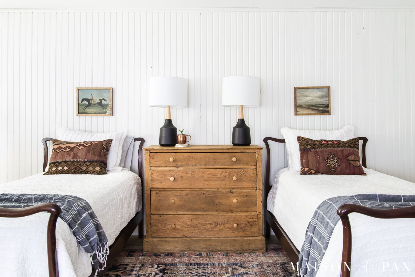 antique twin beds with modern lamps and rustic dresser | maison de pax