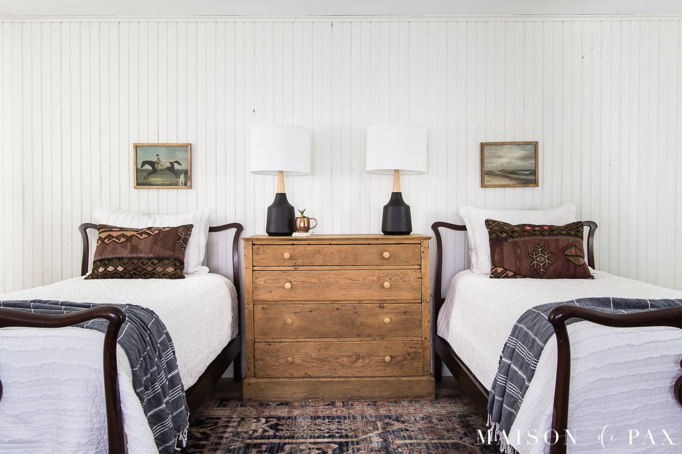 antique twin beds with modern lamps and rustic dresser | maison de pax