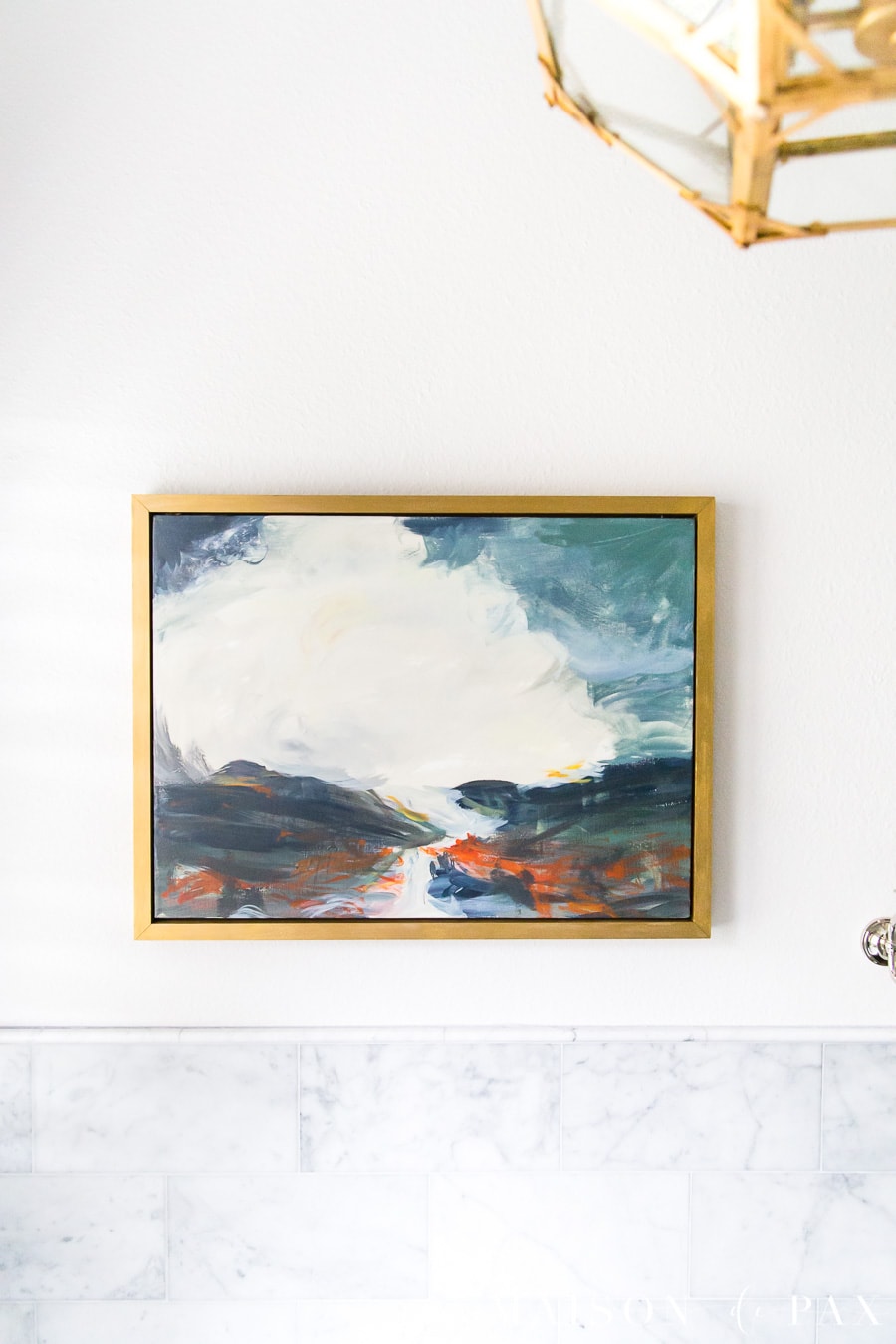 acrylic painting in gold frame hung above tub in master bathroom | Maison de Pax
