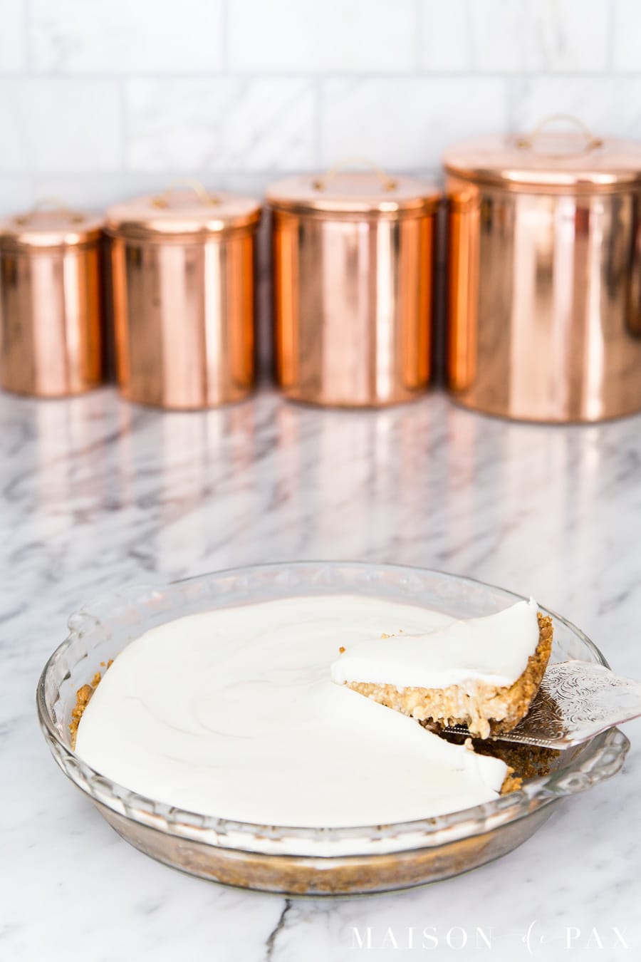 pumpkin cheesecake with sour cream topping in glass pie pan | Maison de Pax