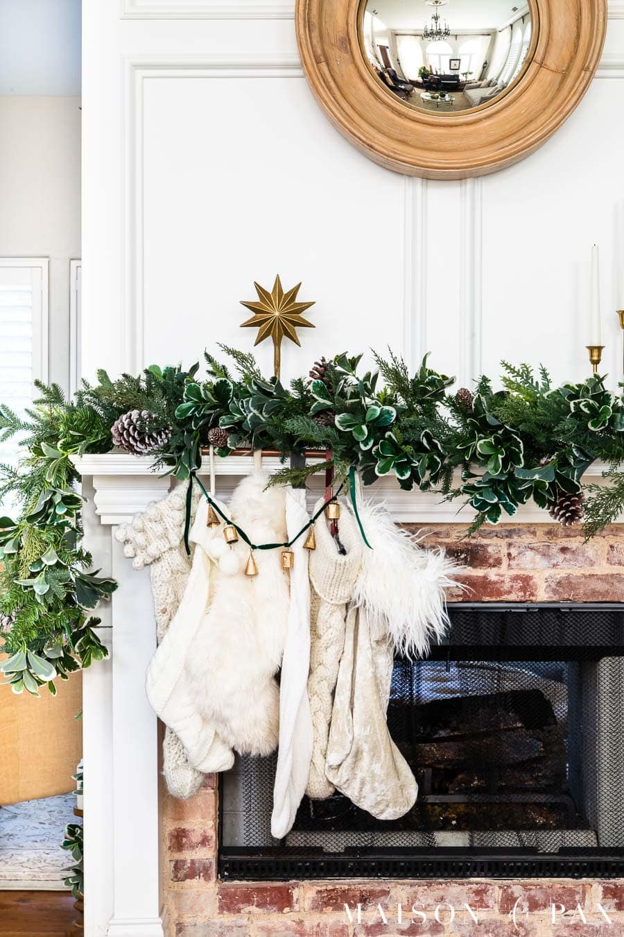asymmetric holiday mantel with pre lit garland
