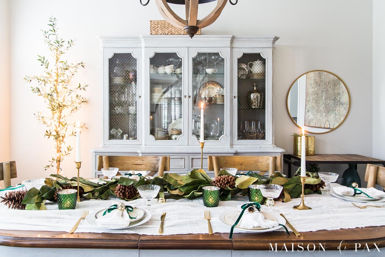 dining table with magnolia garland and candles | Maison de Pax