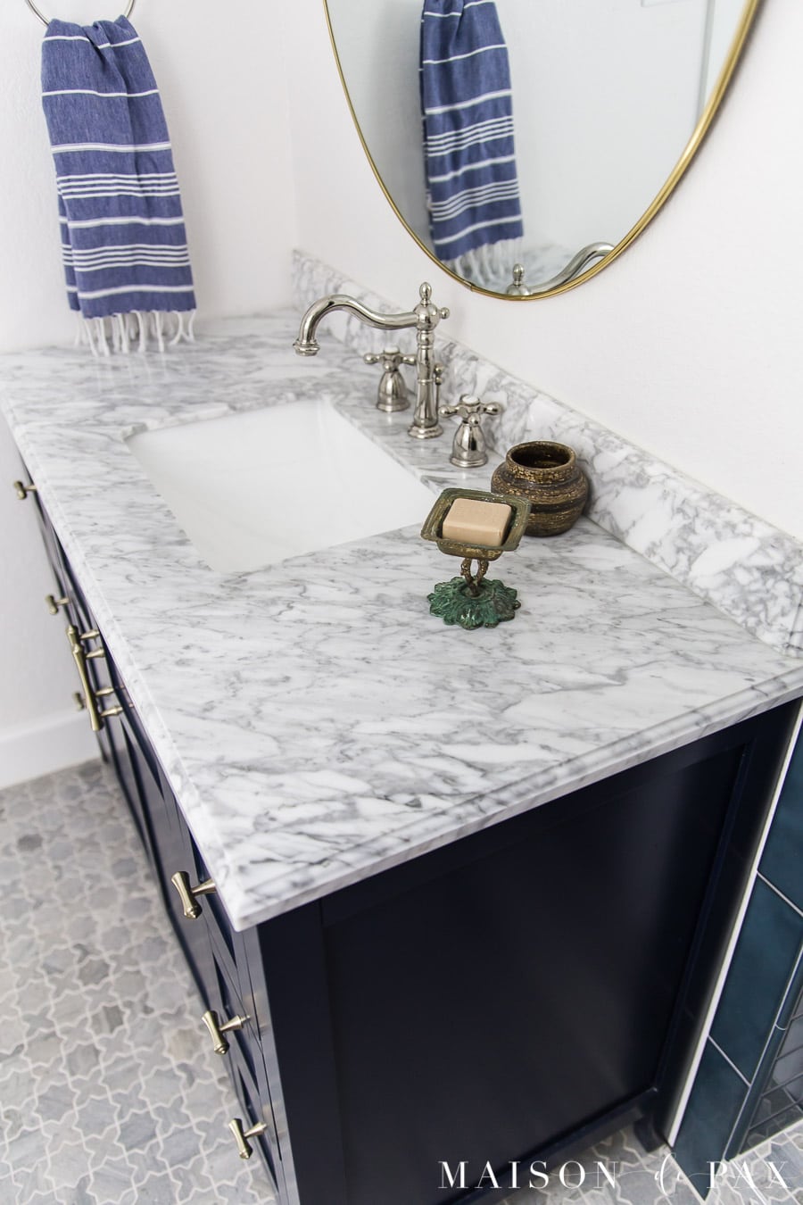 marble countertop and marble floors in guest bathroom