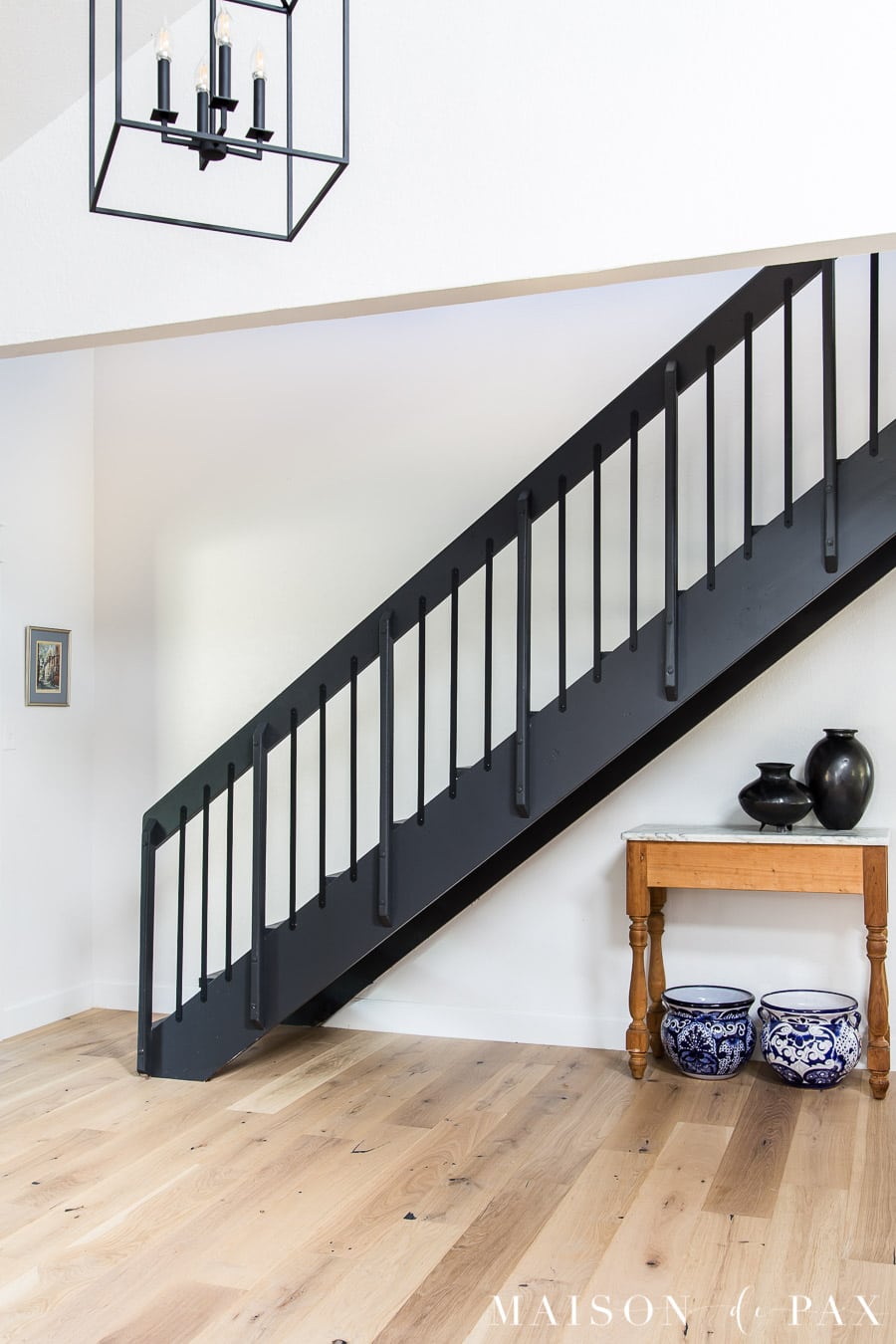 black iron stair railings on floating stairs