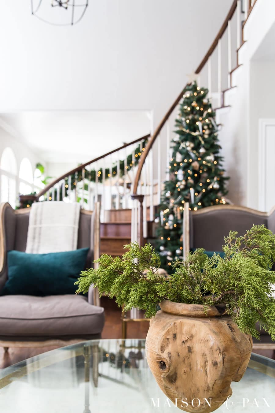 large Christmas tree in curved stairwell