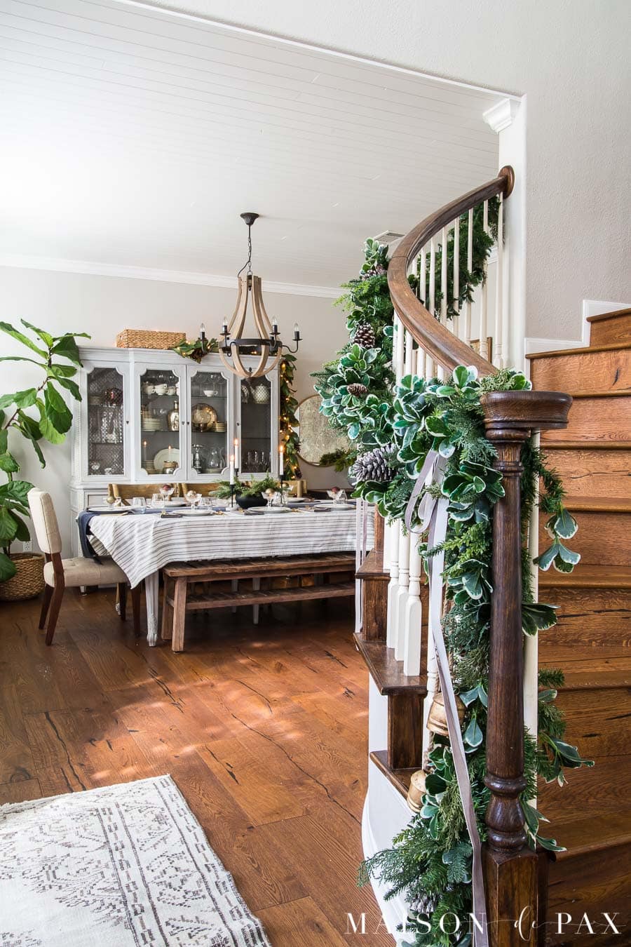 stairwell garland and Christmas dining room