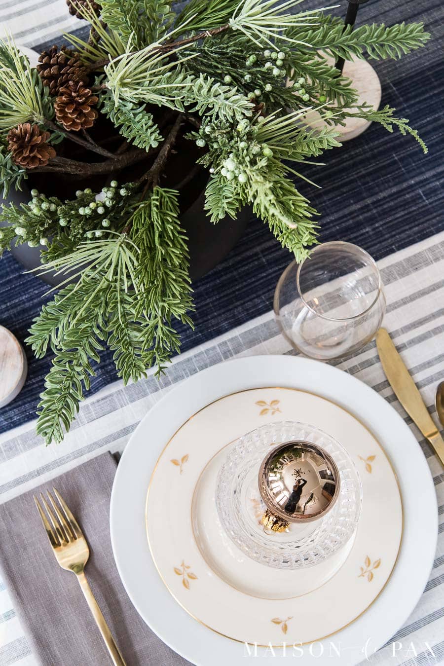 basic white dishes mixed with formal china for a holiday place setting