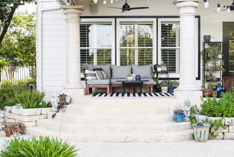 black and white porch with blue accessories