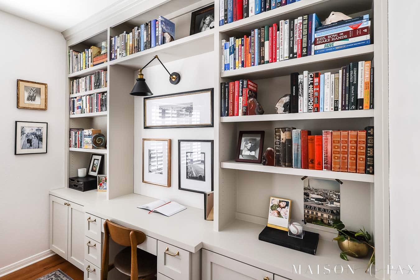 light gray bookcases filled with books and photographs