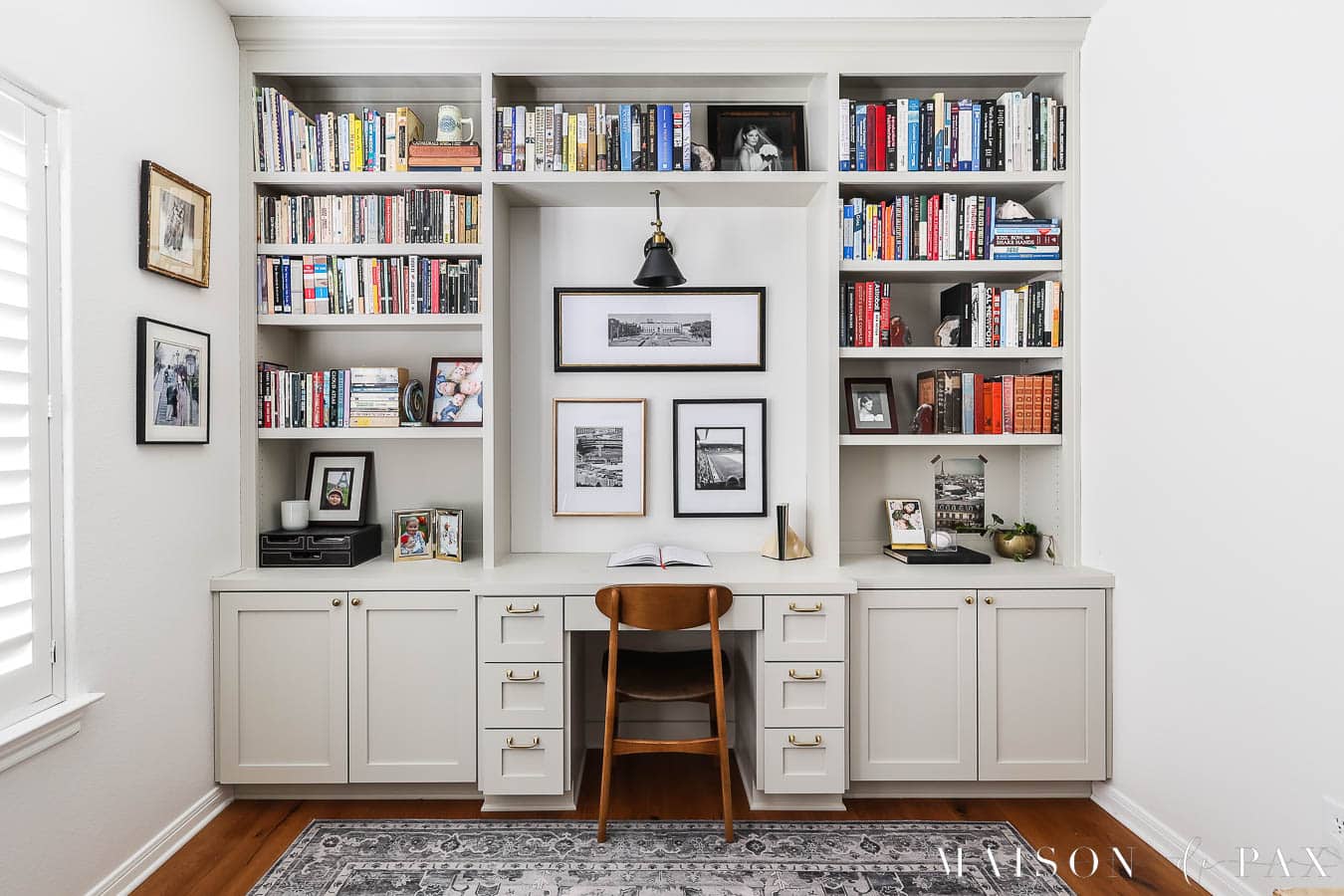 built in bookcase in small bedroom with desk