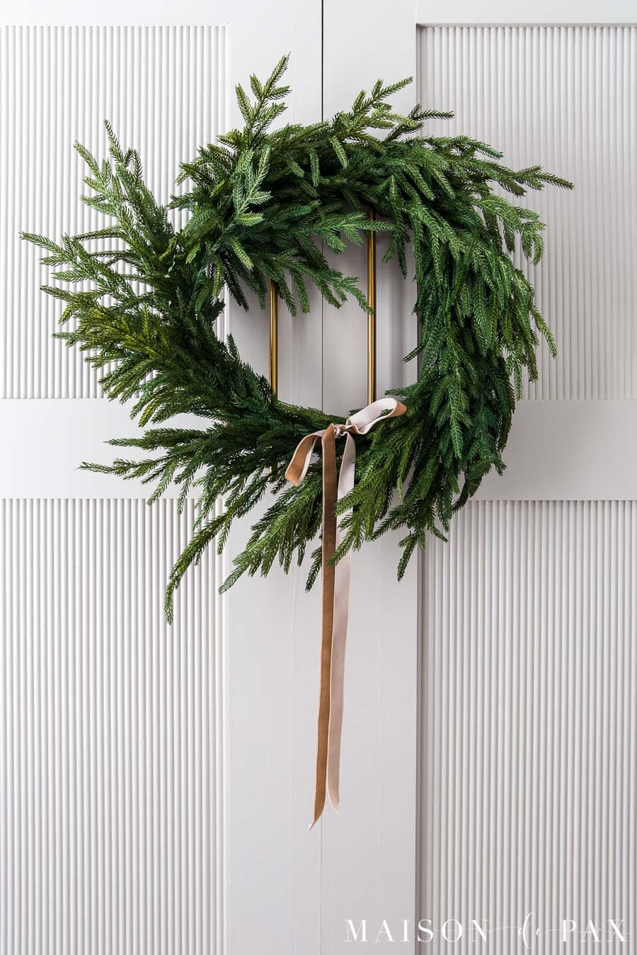 essential holiday decor: pine wreath with vintage gold velvet ribbon