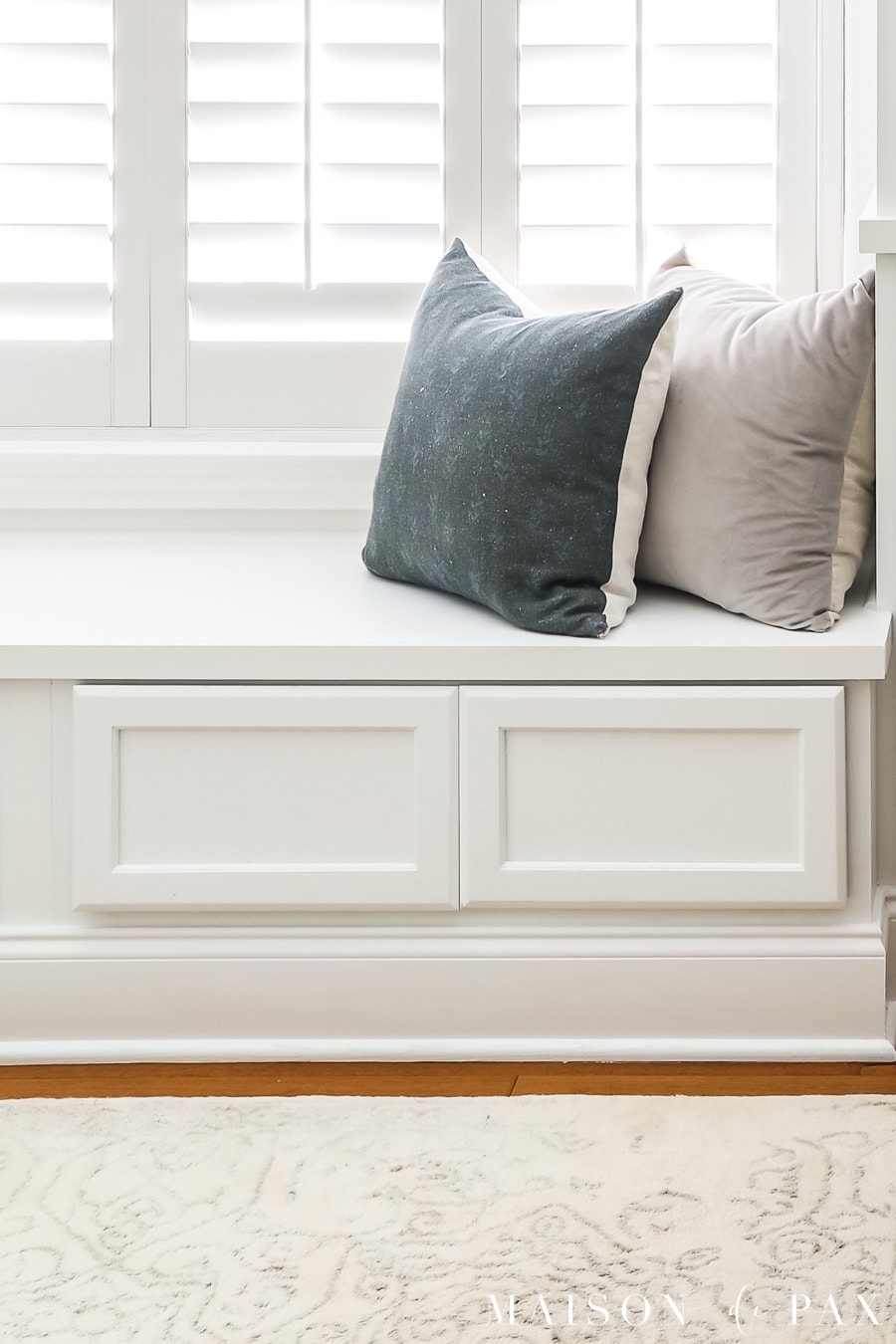 window bench with storage and throw pillows