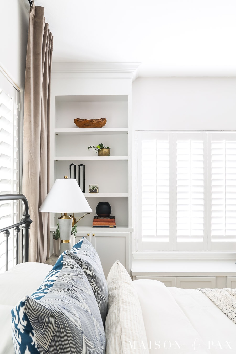 white bookcases with crown molding and simple styling