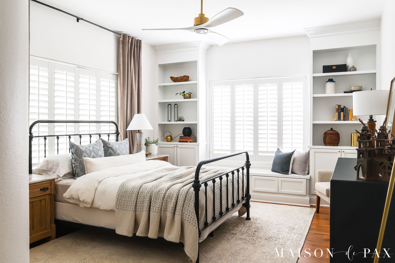 master bedroom with neutral color palette and cozy textures