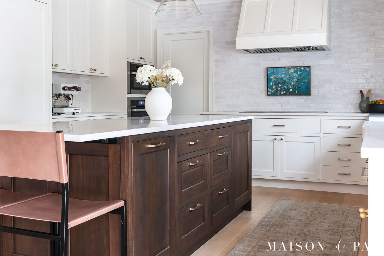 beautiful white kitchen with dark wood island