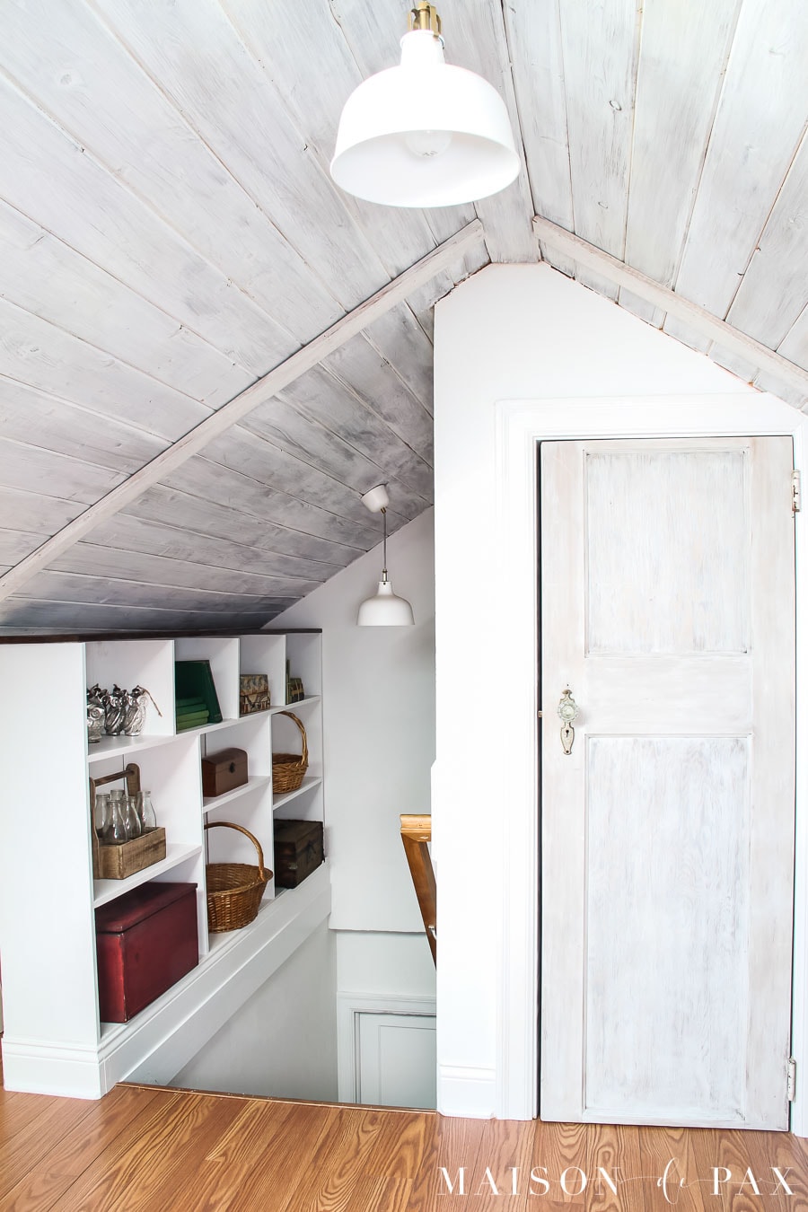 converted attic with bookcase alongside stairs
