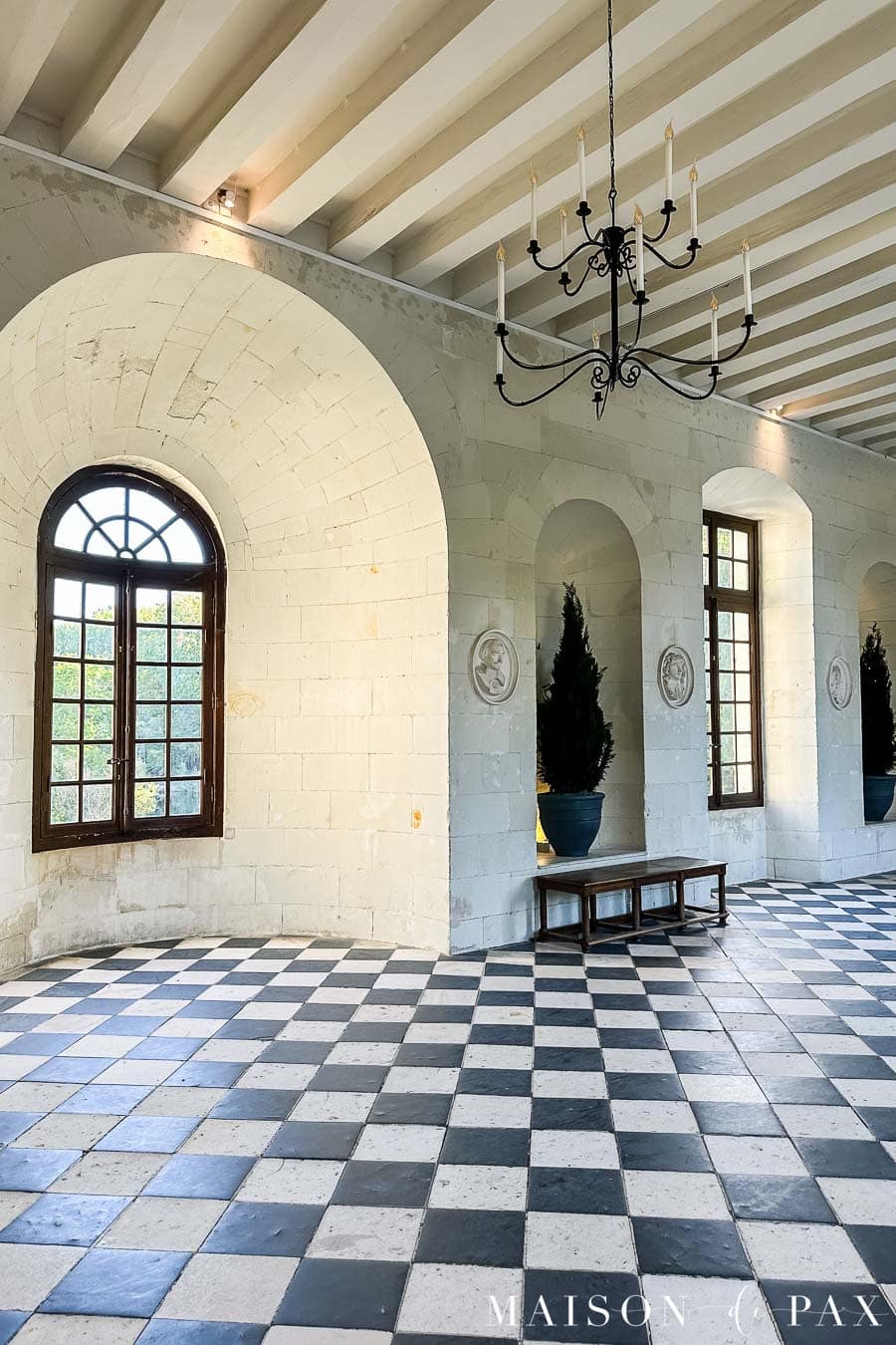 chateau de chenonceau ballroom with checkered floors and ceiling beams