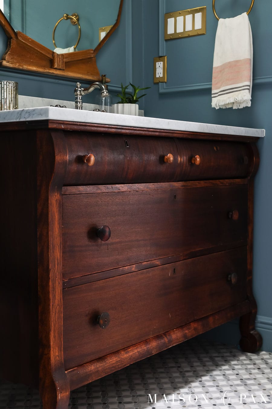 antique wood dresser converted to bathroom vanity with marble top