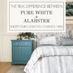 Sherwin Williams Pure White and Alabaster comparison in a bedroom with white paneled walls, warm wood ceiling, upholstered bed, and blue nightstand.
